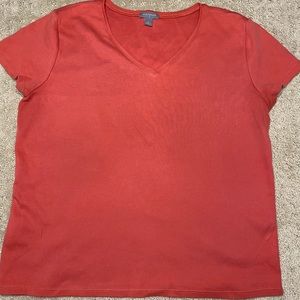 a salmon orange tee